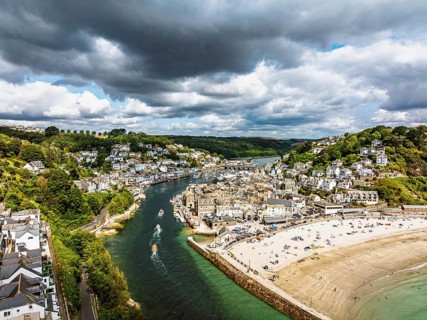 Beach and Cliffs over Looe Bay from a drone, Looe, River Looe, Cornwall, England, United Kingdom