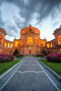 Illuminated Santuario Madonna di San Luca church on the hills of Colle della Guardia, in the