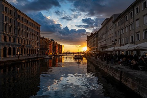 Grand Canal with restaurants, reflection in the canal, sunlight, evening light at sunset, dramatic