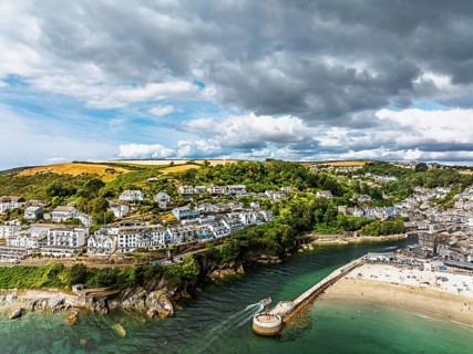 Beach and Cliffs over Looe Bay from a drone, Looe, River Looe, Cornwall, England, United Kingdom