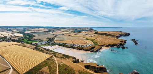 Farms and Fields over Cliffs and Porthcothan Bay from a drone, Porthcothan, Padstow, Cornwall,