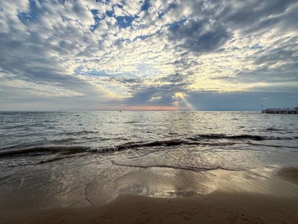 Tranquil sunset over sea with dramatic clouds and soft waves, Side, Manavgat, Antalya Province,