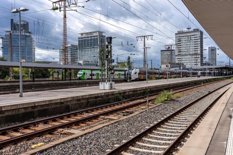 Public transport, S-Bahn, in Essen main station, city skyline, high-rise office buildings, North