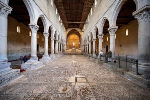 Basilica di Santa Maria Assunta, Basilica of Aquileia with historic floor mosaic in the main nave,
