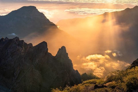 View of the Caldera de Taburiente from Pico de La Nieve at sunset and back light. In the back left,