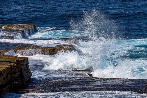 Waves crash into rocks on the coastline at Maroubra, Sydney, New South Wales, Australia