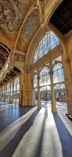 Elegant arcades with incoming sunlight casting long shadows on the ground, Marianske Lazne,