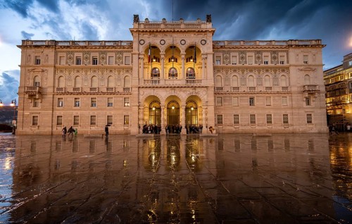Illuminated square Piazza Unità d'Italia, Palazzo della Luogotenenza Austriaca or Palazzo Governo,