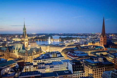 View of Hamburg city center with city hall, Inner Alster and main church of St. Peter at the Blue