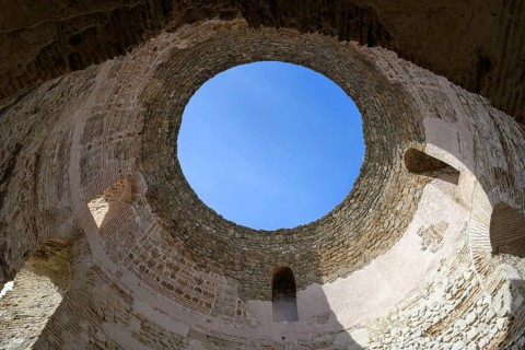Looking up from the vestibule to the sky though the aperture of Diocletian's Palace in Split,