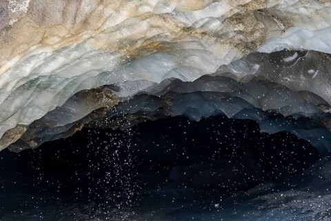 Meltwater at a glacier cave, underground glacier stream, Castner Glacier, Delta Range, Alaska