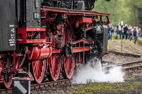 Detailed view of the drive wheels and coupling rods of a steam locomotive, Bochum railway museum,