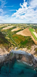Cliffs and Farms over North Devon and Cornwall Coastpath Border from a drone, Welcombe Mouth Beach,