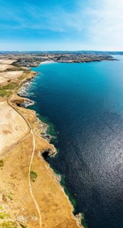 Panorama of Pentire Point and Bay over Padstow Bay from a drone, Polzeath, Cornwall, England,