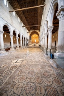 Basilica di Santa Maria Assunta, Basilica of Aquileia with historic floor mosaic in the main nave,
