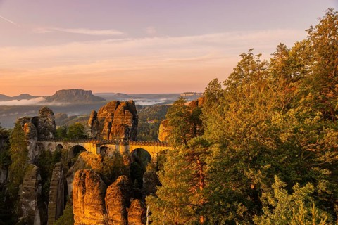 Sunrise on Basteifelsen, Basteibrücke seen from Ferdinandstein, Rathen, Saxony, Germany