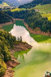 A quiet river snakes through thick forest and green hills, Krumbach, Vorarlberg, Austria