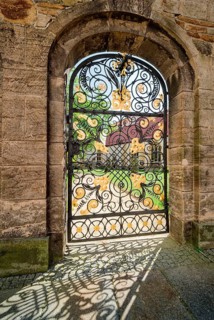 Wrought iron gate with golden ornaments to the Green Cemetery, Freiberg Cathedral St. Marien,