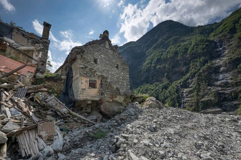 Devastation of a house due to debris and boulders, as a result of heavy rock and debris flow on the
