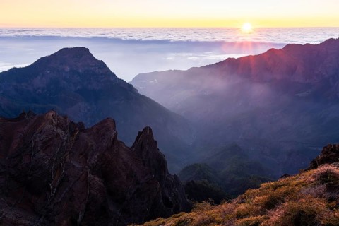 View of the Caldera de Taburiente from Pico de La Nieve at sunset and back light. In the back left,
