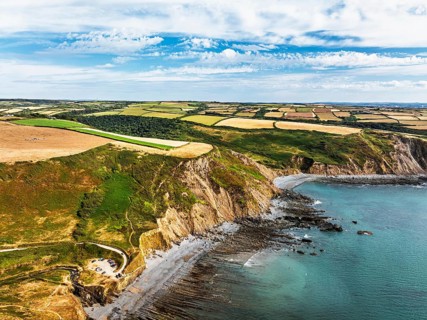 Cliffs and Fields over Welcombe Mouth Beach from a drone, North Devon and Cornwall Coastpath