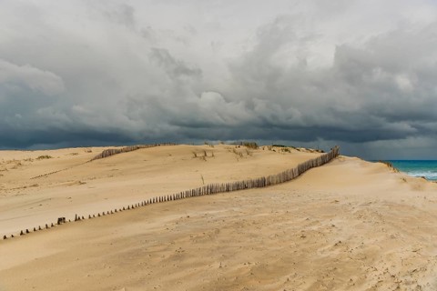 Emerging storm in sunshine in the dunes on the Atlantic coast, Soulac-sur-Mer, France