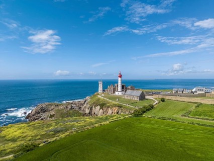 Aerial view of the distinctive red and white lighthouse Phare de Saint-Mathieu on the Breton coast