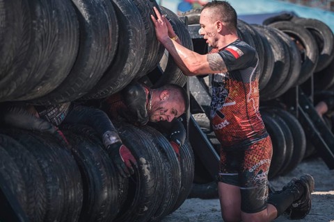 WROCLAW, POLAND - APRIL 7, 2018: Extreme running with obstacle RUNMAGEDDON. In the picture a runner
