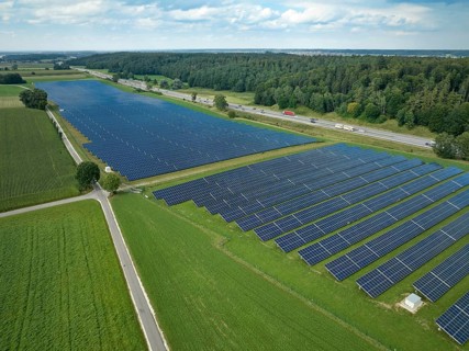 Aerial view of a huge photovoltaik power plant next to a highway in southern Germany, Altenstadt,