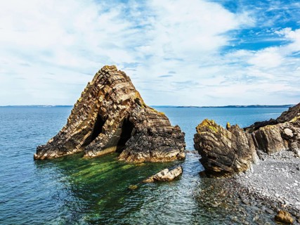 Blackchurch Rock and Cliffs over Mouthmill Beach from a drone, North Devon Coast, Devon, England,