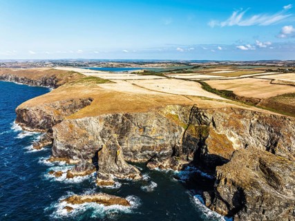 View of cliffs over Gunver Head and Trevone Bay from a drone, Trevone, Padstow, Cornwall, England,