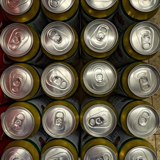View from above of many aluminum beverage cans Aluminum cans for drinks with rip tab Ring pull ring