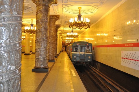 Subway enters a magnificent platform with decorated columns and chandeliers, Metro, Saint