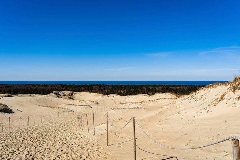 The Gray Dunes, or the Dead Dunes is sandy hills with a bit of green specks at the Lithuanian side
