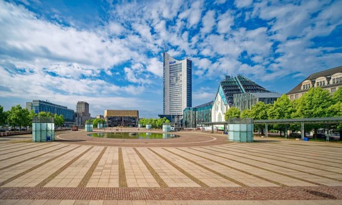 Morning atmosphere, Leipzig Augustusplatz with Gewandhaus, Mendebrunnen, city skyscraper and
