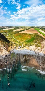 Cliffs and Farms over North Devon and Cornwall Coastpath Border from a drone, Welcombe Mouth Beach,