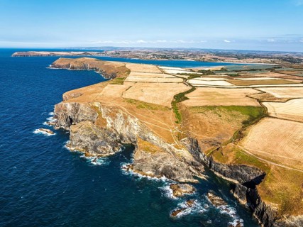 View of cliffs over Gunver Head and Trevone Bay from a drone, Trevone, Padstow, Cornwall, England,