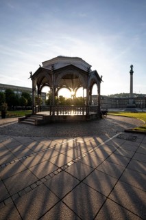 24.4.2026: The ornate cast iron music pavilion on Schlossplatz at sunrise. Sun star effect through