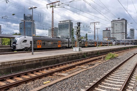 RRX, Rhein-Ruhr-Express, regional express, in Essen main station, city skyline, high-rise office