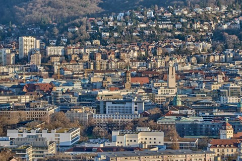 Panoramic view of Stuttgart city center in Germany during spring with warm golden evening light.