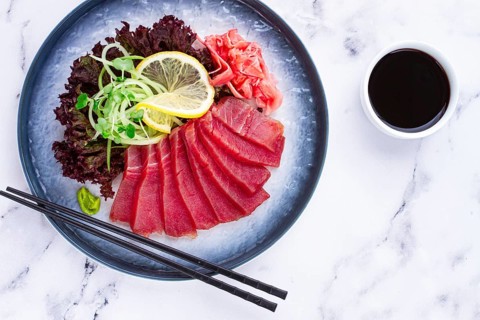 Tuna sashimi, with side dish, on a marble table, homemade, no people