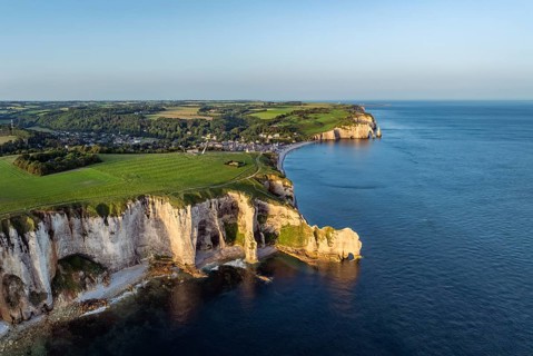 Aerial view of the Porte d'Amont rock formation, Falaise d'Amont shortly after sunrise, a landmark