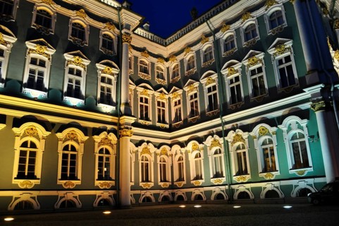 A corner of the palace at night, artfully illuminated, shows numerous windows, Winter Palace,