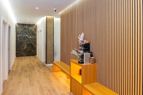 Spacious and inviting hallway in a contemporary aesthetic clinic or wellness center, featuring
