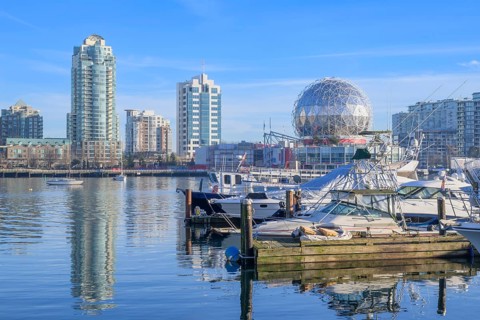 Science World and downtown apartment towers viewed from a marina on False Creek, Vancouver, British