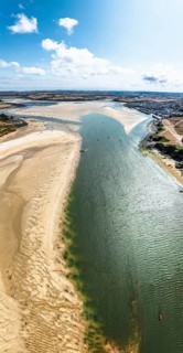 Panorama of River Camel Estuary from a drone at low tide over Padstow and Rock, Cornwall, England,