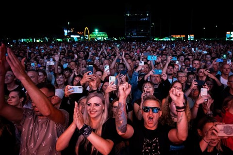 WROCLAW, POLAND - AUGUST 1, 2026: Large enthusiastic crowd enjoying a live outdoor music concert,