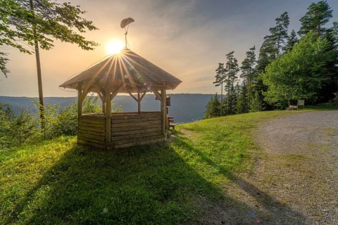 A pavilion facing the light of the setting sun, surrounded by forests, Simmelhütte, Bad Wildbad.