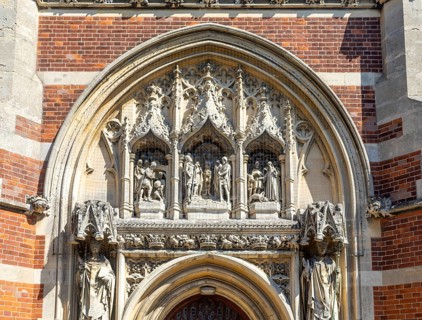 Intricate stone portal relief west entrance of Roman Catholic church of Saint Edmund, Bungay,