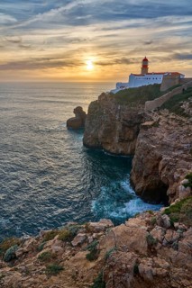 Moody view on Cabo Sao Vicente with its famous lighthouse at sunset at the south.estern spit of